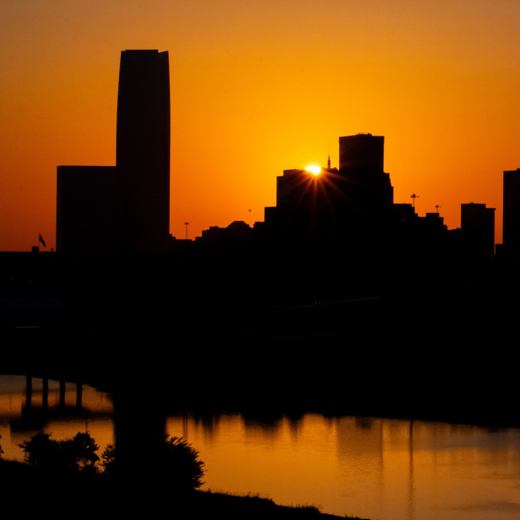 Skyline photo of a city at sunset